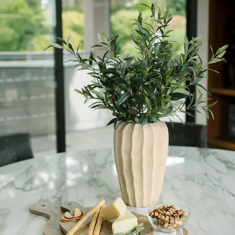 Lifelike olive topiary in an artisan planter from luxury decor brand CG Hunter