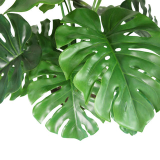Lush green leaves of a lifelike Monstera plant by CG Hunter, designed to replicate natural foliage, ideal for enhancing modern decor.