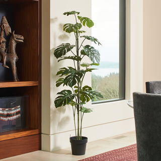 Stylish 5' Artificial Monstera Tree by CG Hunter in a sleek black pot, enhancing a contemporary interior with its realistic foliage.
