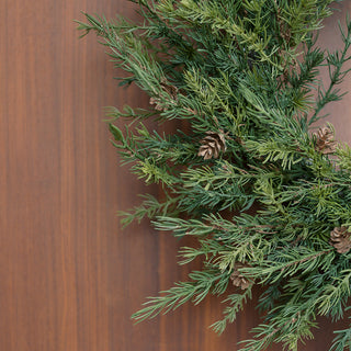 Detail view of the 28" Artificial Pine Wreath with Pinecones by CG Hunter, highlighting the realistic foliage and charming pinecones, ideal for luxurious seasonal arrangements.