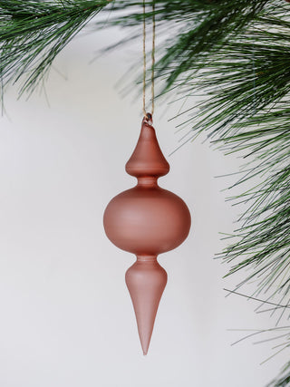 A soft matte rose glass finial ornament reflecting sophisticated style, part of the CG Hunter assortment of vintage rose and Bordeaux glass decor for holiday celebrations.