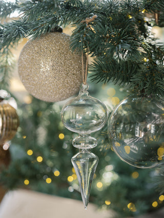Chic antique gold glass finial ornament by CG Hunter, designed with a stunning neutral hue, adding elegance to holiday tree decor.