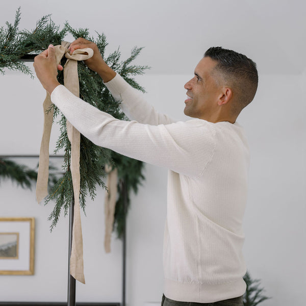 Wide ribbon to hang garland on bed frame