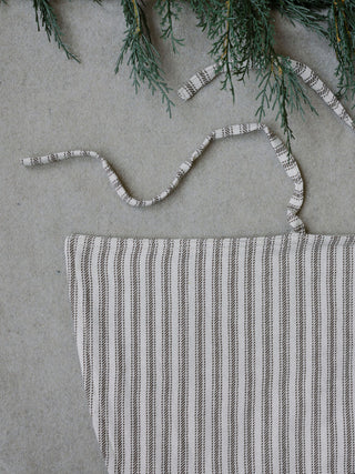 Elegant Ticking Stripe Reversible Tree Skirt by CG Hunter, showcasing a beautiful striped pattern with a tie closure, perfect for adding a refined touch to your holiday decor.