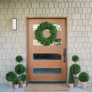 Where to buy spring door decor: CG Hunter spring decor ideas with a 30-inch artificial boxwood wreath and 17-inch and 24-inch artificial boxwood plants in round, tapered, and topiary pots.