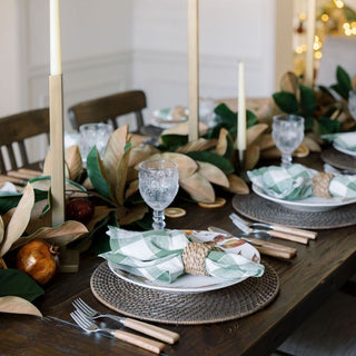 CG Hunter brass square iron candle holders styled on a fall tablescape with magnolia garland