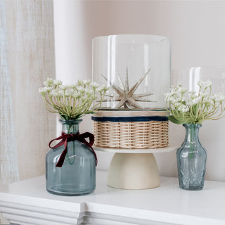 Glass vases wrapped in red, white, and blue ribbon for a sophisticated Fourth of July
