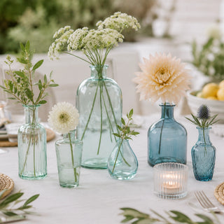 A luxurious display of CG Hunter's entertaining essentials featuring elegant vases, a pedestal bowl, decorative serving trays, and modern table decor, perfect for enhancing any gathering in the 'Gifts for the Entertainer' collection.