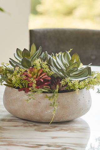 A stunning arrangement of realistic faux succulents in a sleek, modern planter, showcasing a blend of vibrant greens and deep reds, perfect for elevating luxury home or office décor. Ideal for those seeking low-maintenance greenery options.