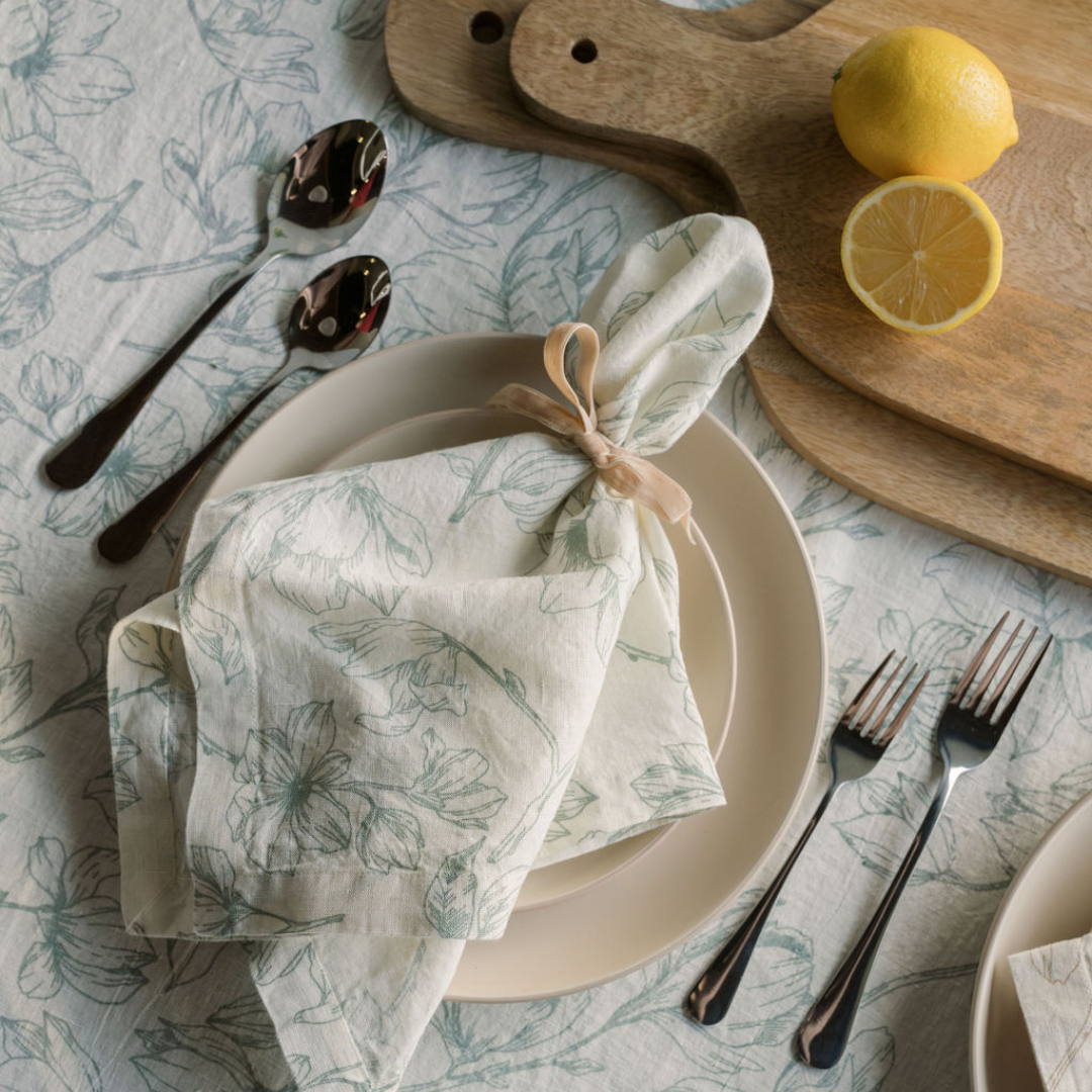 Blue and white floral linen napkin on matching spring tablescape