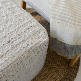Close-up of the intricate woven texture of CG Hunter Square Striped Woven Ottoman Pouf, highlighting exquisite artisanal details.