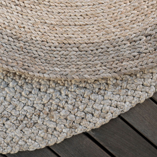 Close-up detail of the CG Hunter Natural and Brown Round Braided Jute Rug, showcasing the intricate braided design and texture, perfect for enhancing luxury home decor.