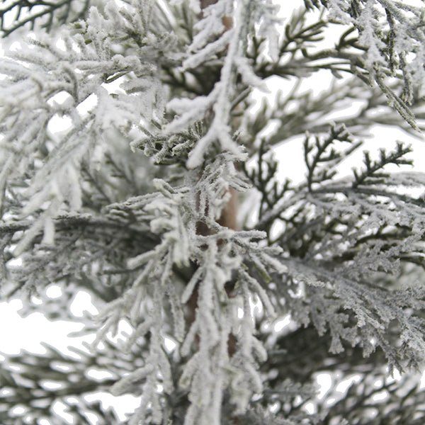 Close-up of lifelike frosted branches of the 2' Flocked Cedar Tree by CG Hunter, showcasing exquisite snowy details ideal for festive arrangements.