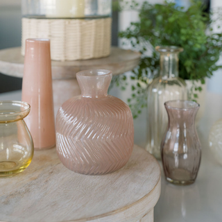 Close-up of CG Hunter Handcrafted Assorted Yellow and Peach Glass Bud Vases, showcasing their intricate designs and soft colors, perfect for chic decor.