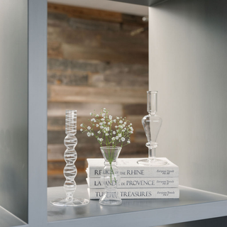Stylish display of CG Hunter etched borosilicate glass bud vases arranged with delicate flowers on stacked books, perfect for home decor.