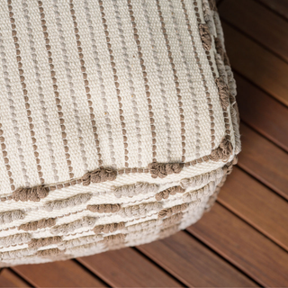 Close-up view of Square Handwoven Loop Ottoman Pouf by CG Hunter, highlighting its intricate texture and luxurious jute fibers for refined home aesthetics.