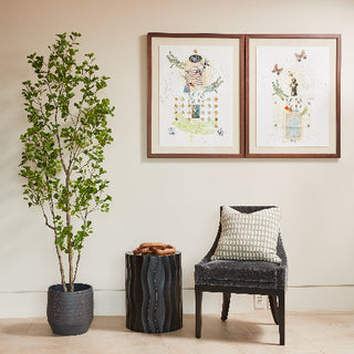 Chic and contemporary room highlighted by CG Hunter's 7' Artificial Heart Ficus Tree paired with a fashionable chair and artistic elements.