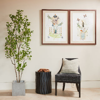 Luxurious living space featuring CG Hunter's 7' Artificial Heart Ficus Tree, elegantly placed beside artistic framed prints and a chic armchair, adding a touch of modern sophistication.