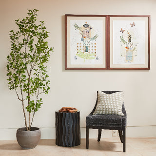 Stylish corner showcasing CG Hunter's 7' Artificial Heart Ficus Tree in a contemporary pot, complemented by elegant decor items, enhancing the refined atmosphere of the room.