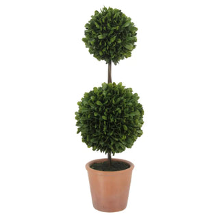 Potted artificial topiary plant with two spherical shapes on a white background