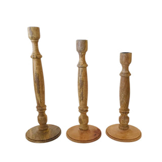 Artisanal Tapered Candle Holder set by CG Hunter, showcasing three beautifully handcrafted candleholders in natural wood, emphasizing intricate detailing and rustic charm, perfect for adding elegance to any decor.