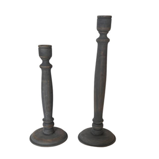 Elegant tapered candle holders set by CG Hunter, crafted from dark grey wood, showcasing exquisite craftsmanship and contemporary design in a stylish display.