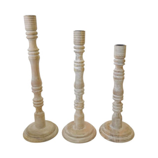 Set of three handcrafted white mango wood tapered candle holders by CG Hunter, highlighting intricate details and a sophisticated design, perfect for enhancing any elegant space.