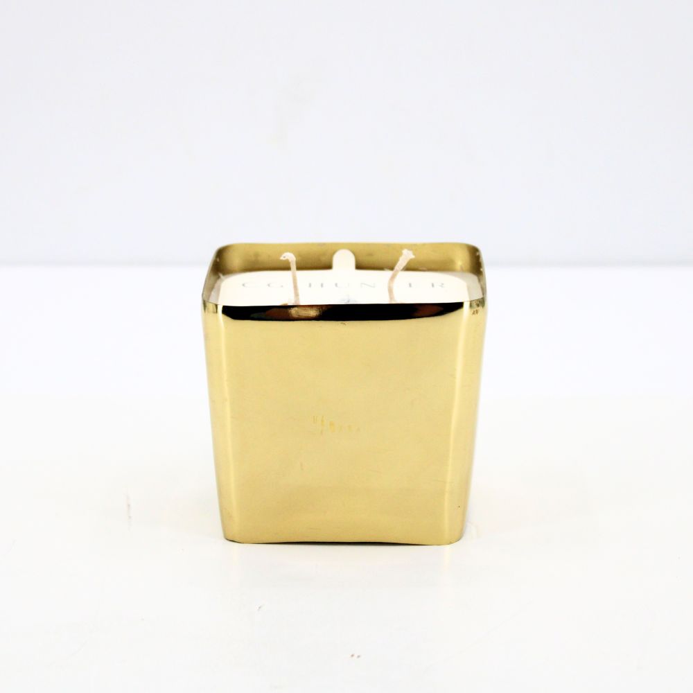 Elegant CG Hunter Balsam and Fir Candle featuring a gold square vessel, designed to infuse your home with the warm essence of fresh evergreens.