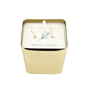 CG Hunter Winter White Candle in a luxurious gold container, showcasing an elegant design perfect for holiday decor.