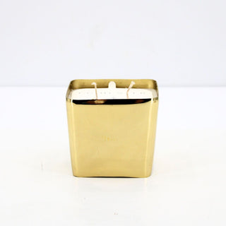 Stylish CG Hunter Winter White Candle with a sleek gold exterior, ideal for adding warmth and sophistication to any space.