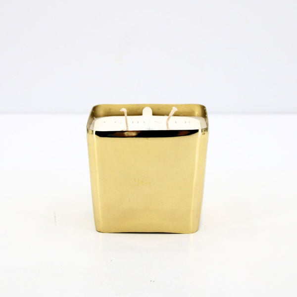 Stylish CG Hunter Winter White Candle with a sleek gold exterior, ideal for adding warmth and sophistication to any space.