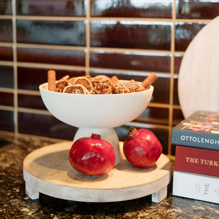 Stylish Charlotte Serving Bowl by CG Hunter filled with dried fruits and spices, elegantly displayed on a wooden tray amidst luxurious cookbooks in a contemporary kitchen.