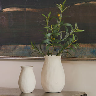 Elegant Charlotte Aluminum Vases by CG Hunter, showcasing a large white vase with lush greenery, perfect for modern home decor.