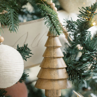 Charming 5" Wooden Tree Christmas Ornament elegantly displayed on a tree, crafted from sustainable mango wood by CG Hunter, perfect for adding a natural touch to holiday festivities.