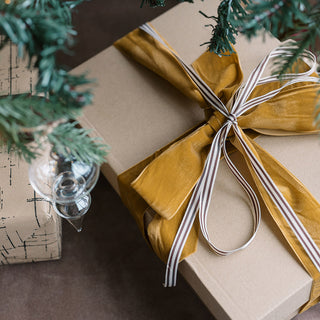 Luxurious gift wrapped with wide hand dyed velvet ribbon in gold, showcasing the elegance of CG Hunter's 10 Yards Per Spool – Set of 2, ideal for holiday decorations and sophisticated gift giving.