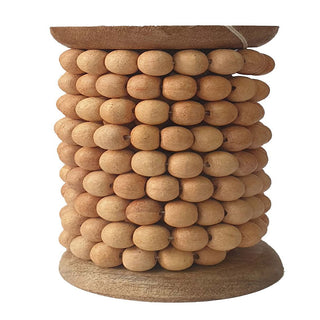 Elegant display of 8' Natural Wood Bead Garland by CG Hunter, showcasing handcrafted wooden beads meticulously arranged for timeless holiday styling.