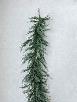 Luxurious 9' Faux Cedar Garland Evergreen by CG Hunter, featuring realistic greenery that enhances the beauty of festive environments.