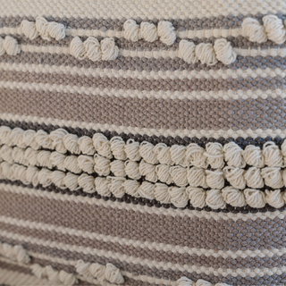 Detailed texture shot of the Square Handwoven Stripe Loop Ottoman Pouf by CG Hunter, featuring a blend of striped patterns and artisanal craftsmanship, ideal for elegant interiors.