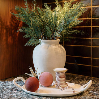 Elegant home decor featuring CG Hunter's Grosgrain Ribbon in Cream and Tan, nestled among natural elements, ideal for adding charm to any arrangement.