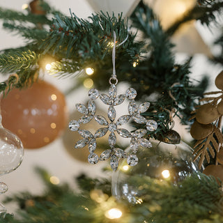 Elegant beaded snowflake ornament hanging on a Christmas tree, featuring intricate jewel detailing. Crafted by CG Hunter, part of the Beaded Snowflake and Star Christmas Ornaments collection.