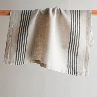 Elegant striped napkin in black and ivory by CG Hunter, handcrafted from 100% linen, measuring 21.5" x 21.5", perfect for enhancing dining decor.