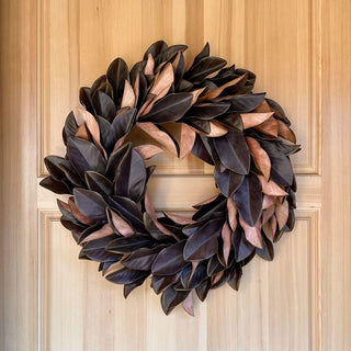 Luxurious 30" Faux Brown Magnolia Leaf Wreath by CG Hunter, artfully displayed on a wooden door, showcasing its rich Southern charm.