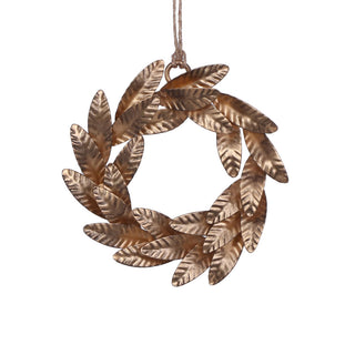 Lustrous 5-inch iron wreath ornament in brass, elegantly displayed against a white backdrop, perfect for holiday decorations. A handcrafted luxury piece by CG Hunter.
