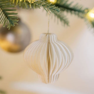 Charming Mini Paper Honeycomb Ornament in creamy white by CG Hunter, showcasing intricate pleated design, ideal for enhancing festive decor with a touch of sophistication.