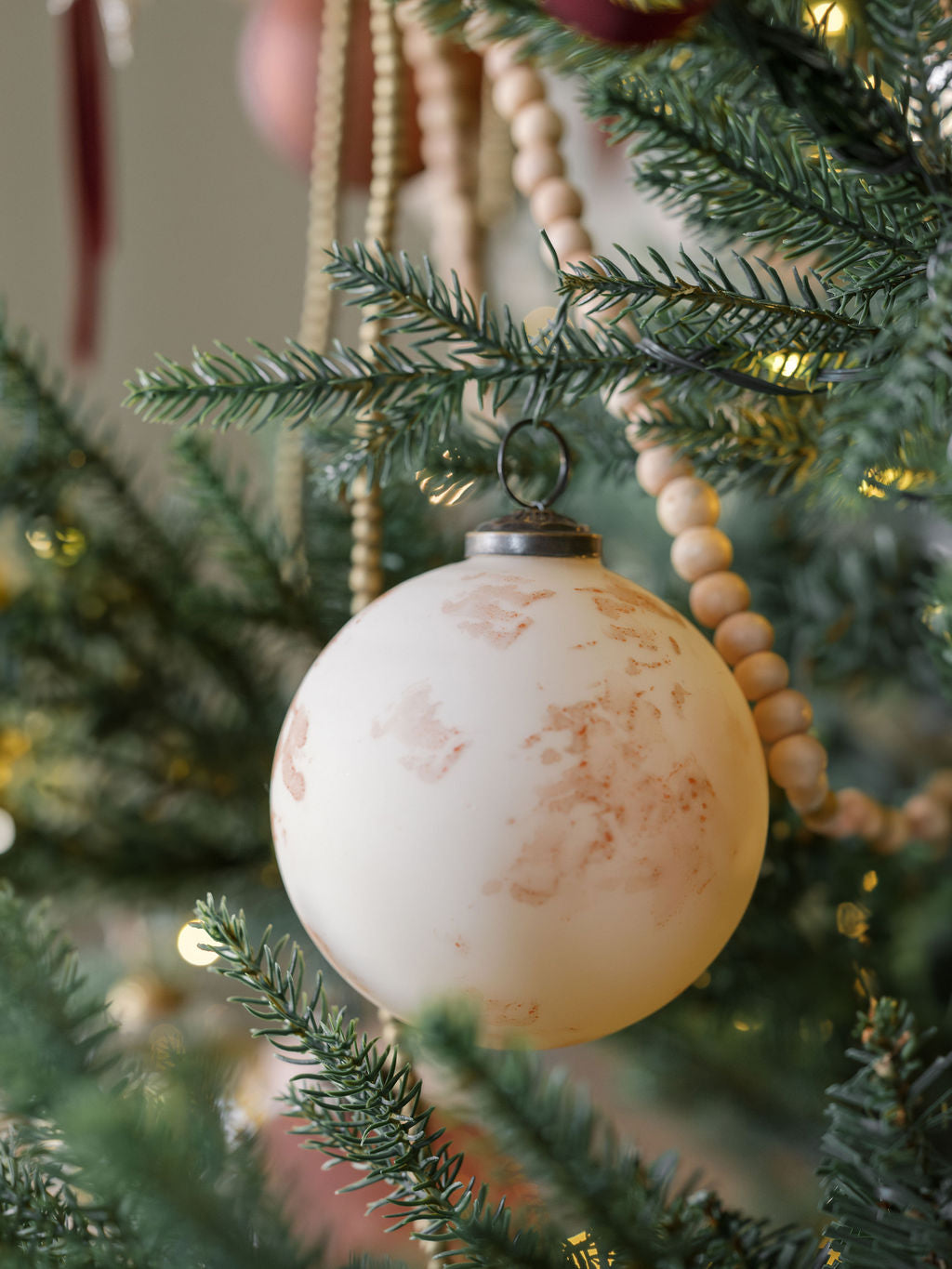 4" Marble Matte Cream Glass Ornament - Set of 4 on tree