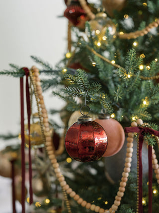 Elegant 3" Mercury Glass Bordeaux Ornament from CG Hunter, beautifully hung on a festive tree, capturing timeless charm in rich bordeaux color.