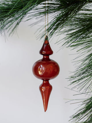 Close-up of a rich Bordeaux glass finial ornament, embodying luxury and charm, from the assorted vintage rose and Bordeaux glass collection by CG Hunter.