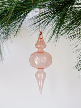 Close-up of a delicate pink glass finial ornament, showcasing its vintage elegance, part of the assorted vintage rose and Bordeaux collection by CG Hunter.