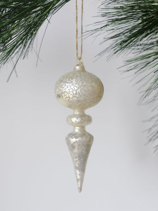 Close-up of a shimmering silver glass finial ornament from the assorted neutral palette collection by CG Hunter, perfect for adding a touch of elegance to holiday decorations.