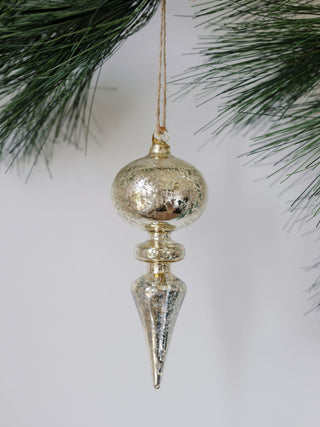 Detailed view of a gold glass finial ornament from CG Hunter's assorted neutral palette collection, showcasing luxurious texture and shine for festive decor.